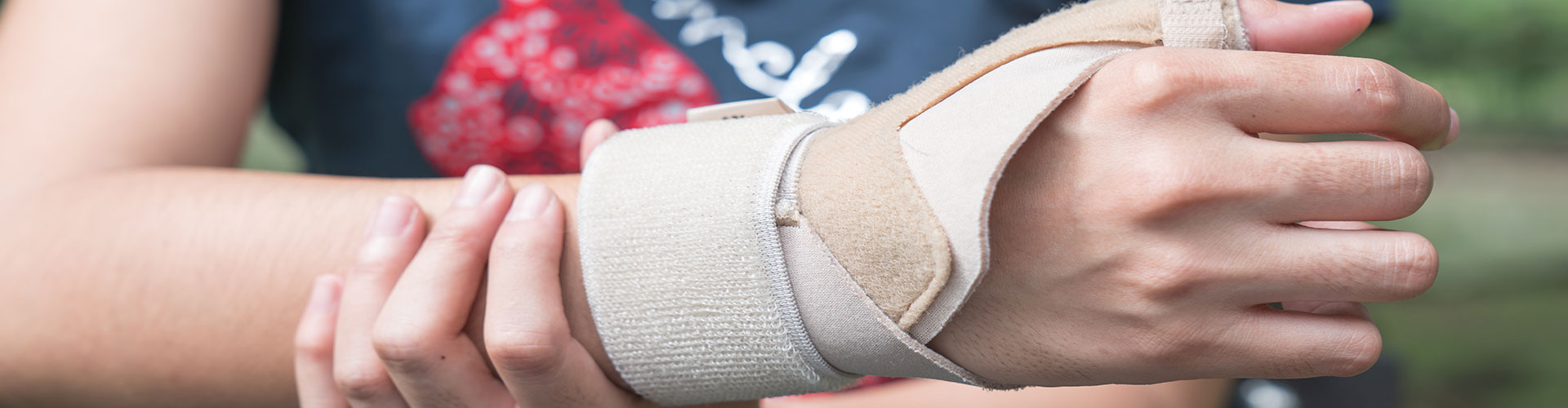 injured woman with wristband compression